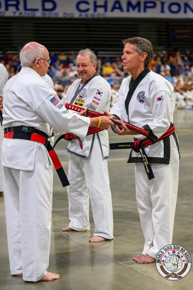 Dr. Tim Schroeder, a sixth-degree black belt, being recognized at the World Tang Soo Do Association World Championships